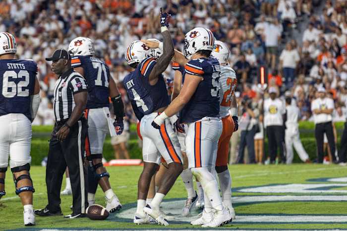 Tank Bigsby celebrates with Tate Johnson after scoring a touchdown against Mercer.